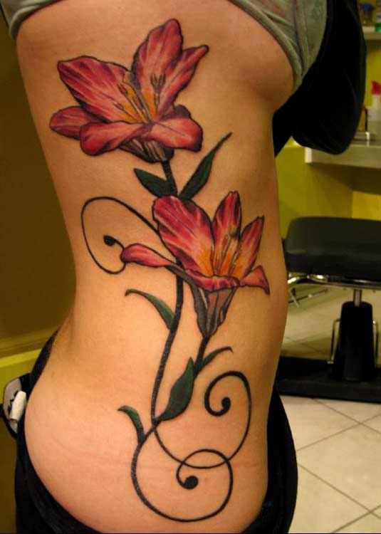tattoo of flowers. flowers tattoos on chest.